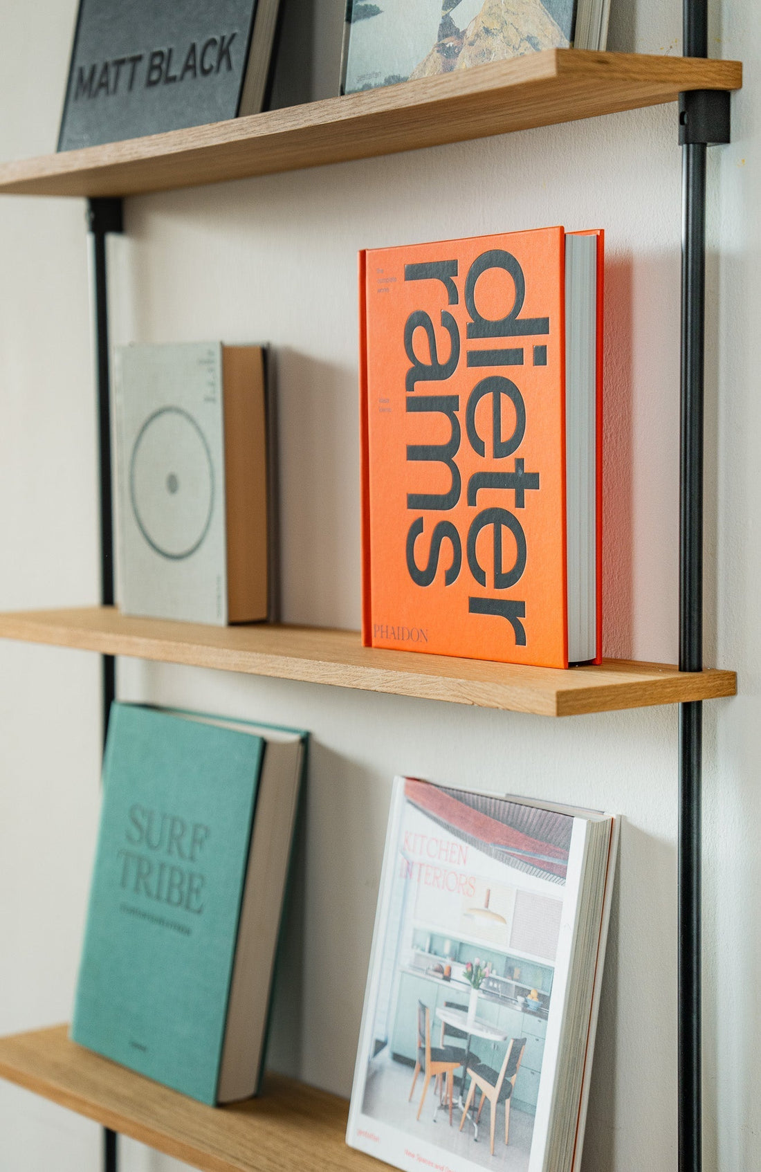 Wall-mounted oak shelf, photographed in a room