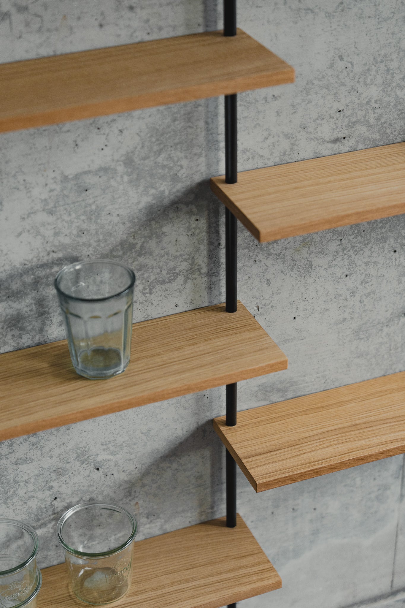 Large triple-section oak wall shelf with offset levels — KUUDU modular shelving system