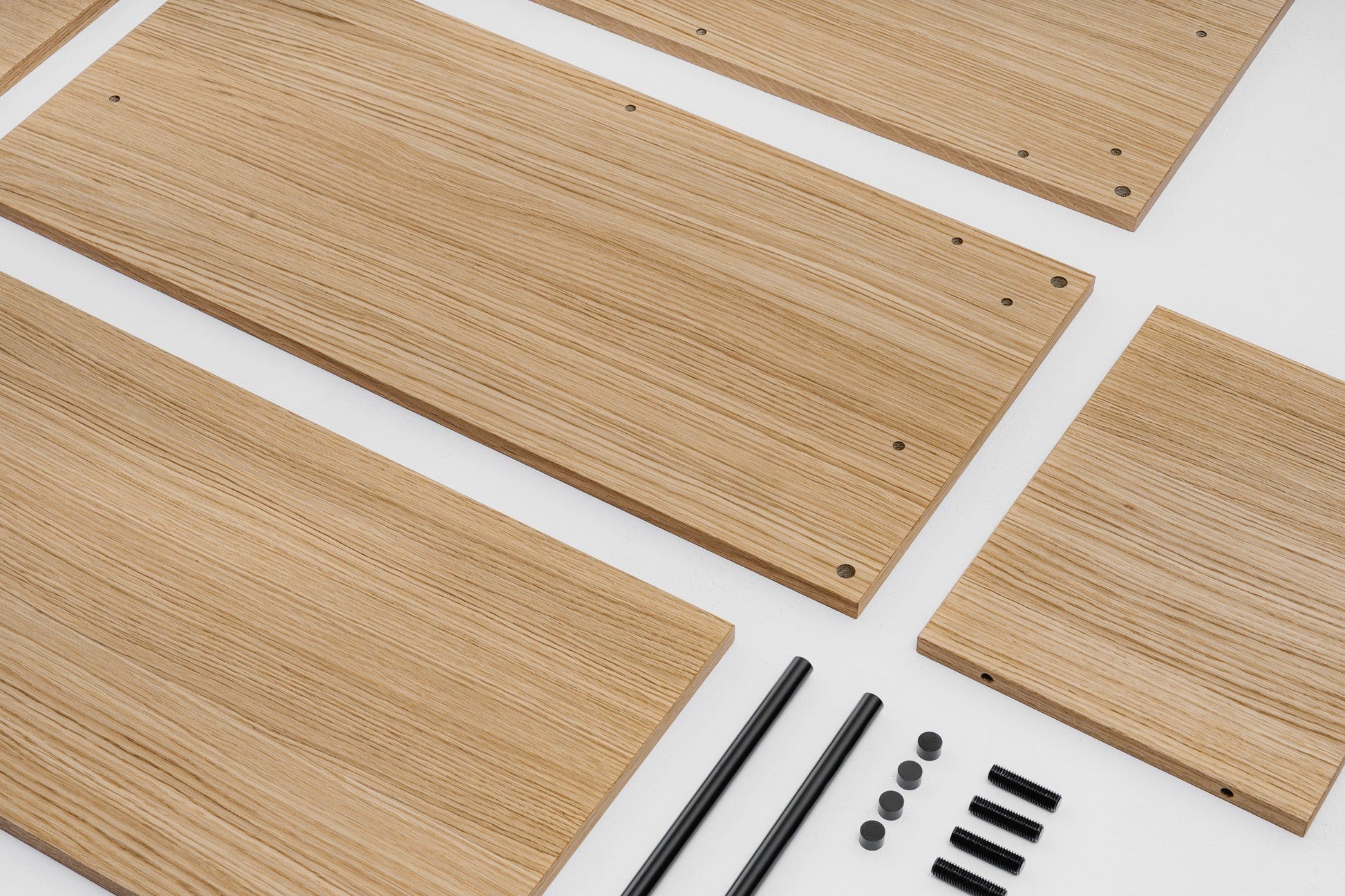 KUUDU modular shelving system in oak — interior lifestyle photograph