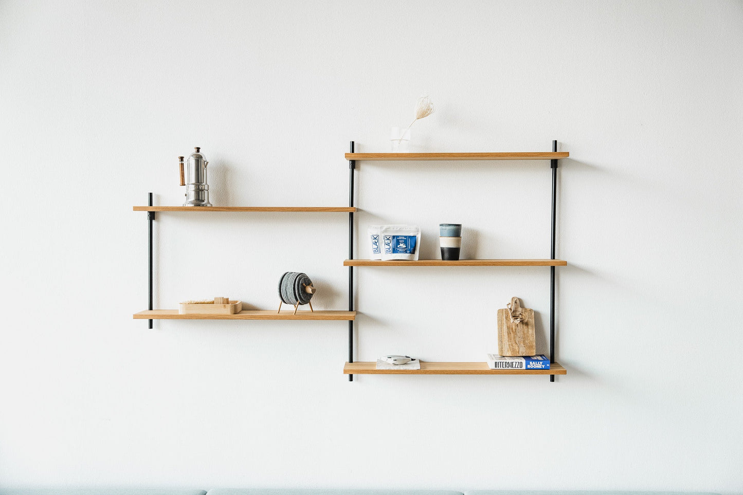 Scandi-style oak wall shelf with offset sections — KUUDU modular shelving system