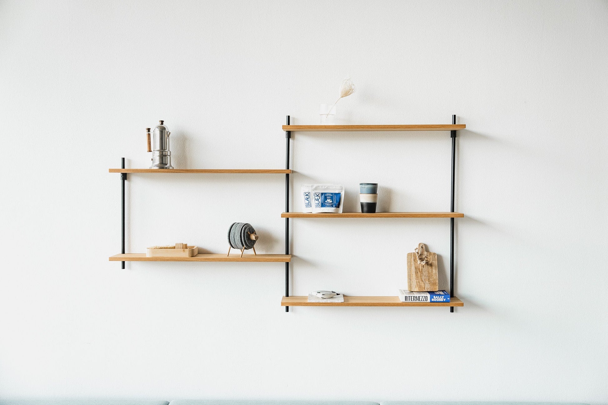 Scandi-style oak wall shelf with offset sections — KUUDU modular shelving system