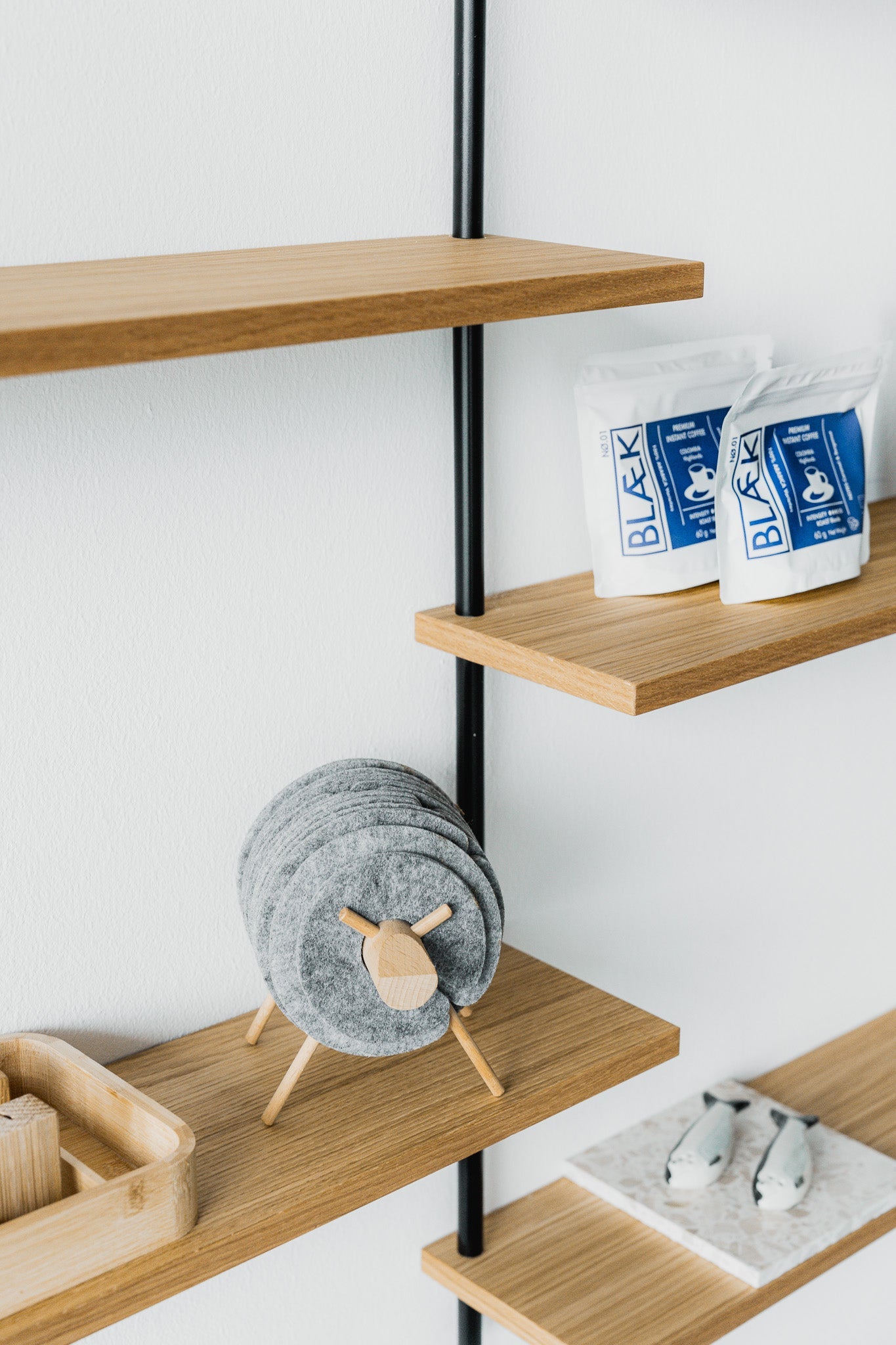 Scandi-style oak wall shelf with offset sections — KUUDU modular shelving system