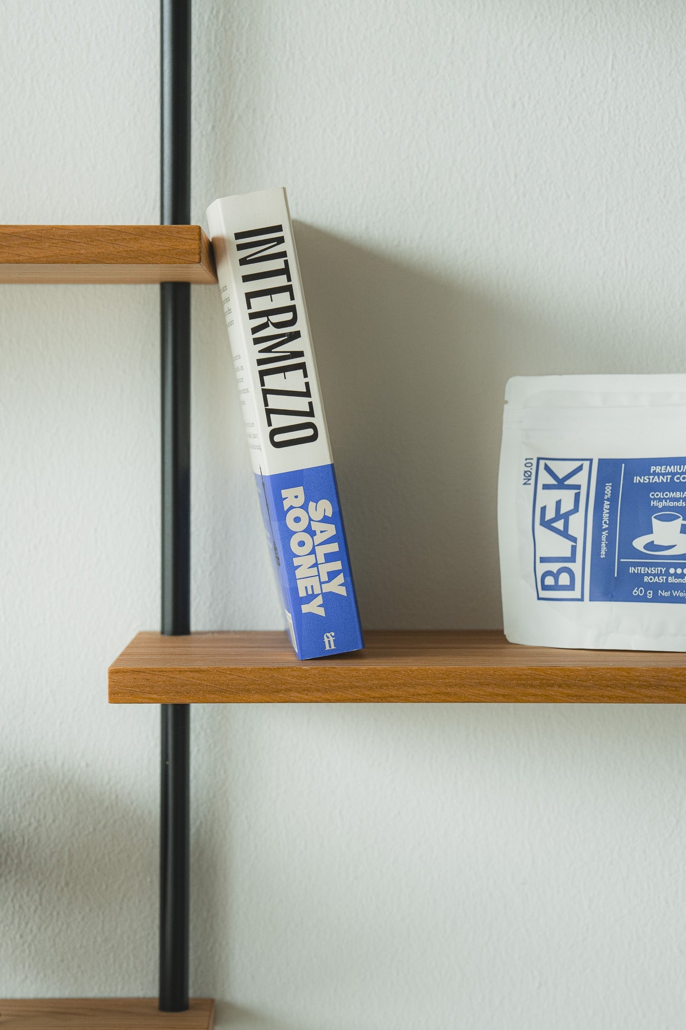Scandi-style oak wall shelf with offset sections — KUUDU modular shelving system