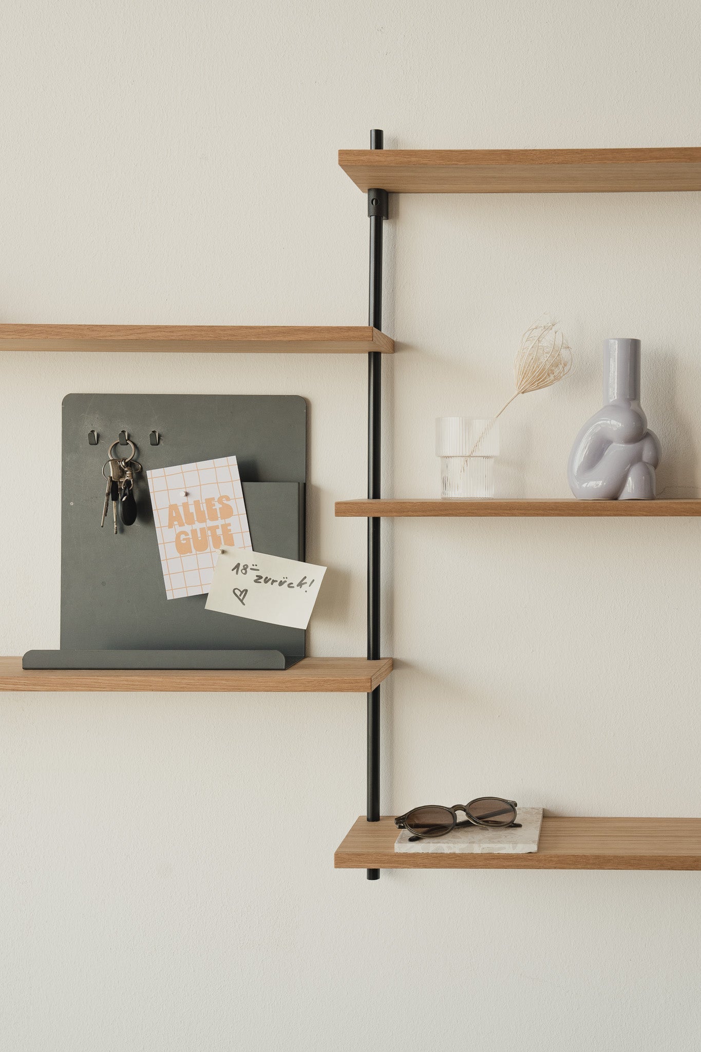 Scandi-style oak wall shelf with offset sections — KUUDU modular shelving system