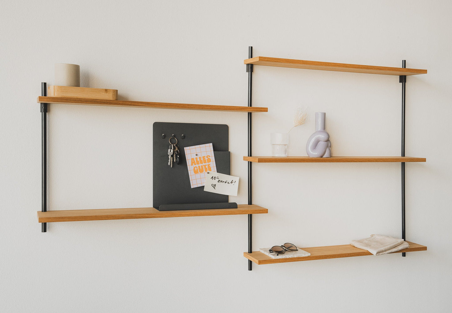 Scandi-style oak wall shelf with offset sections — KUUDU modular shelving system