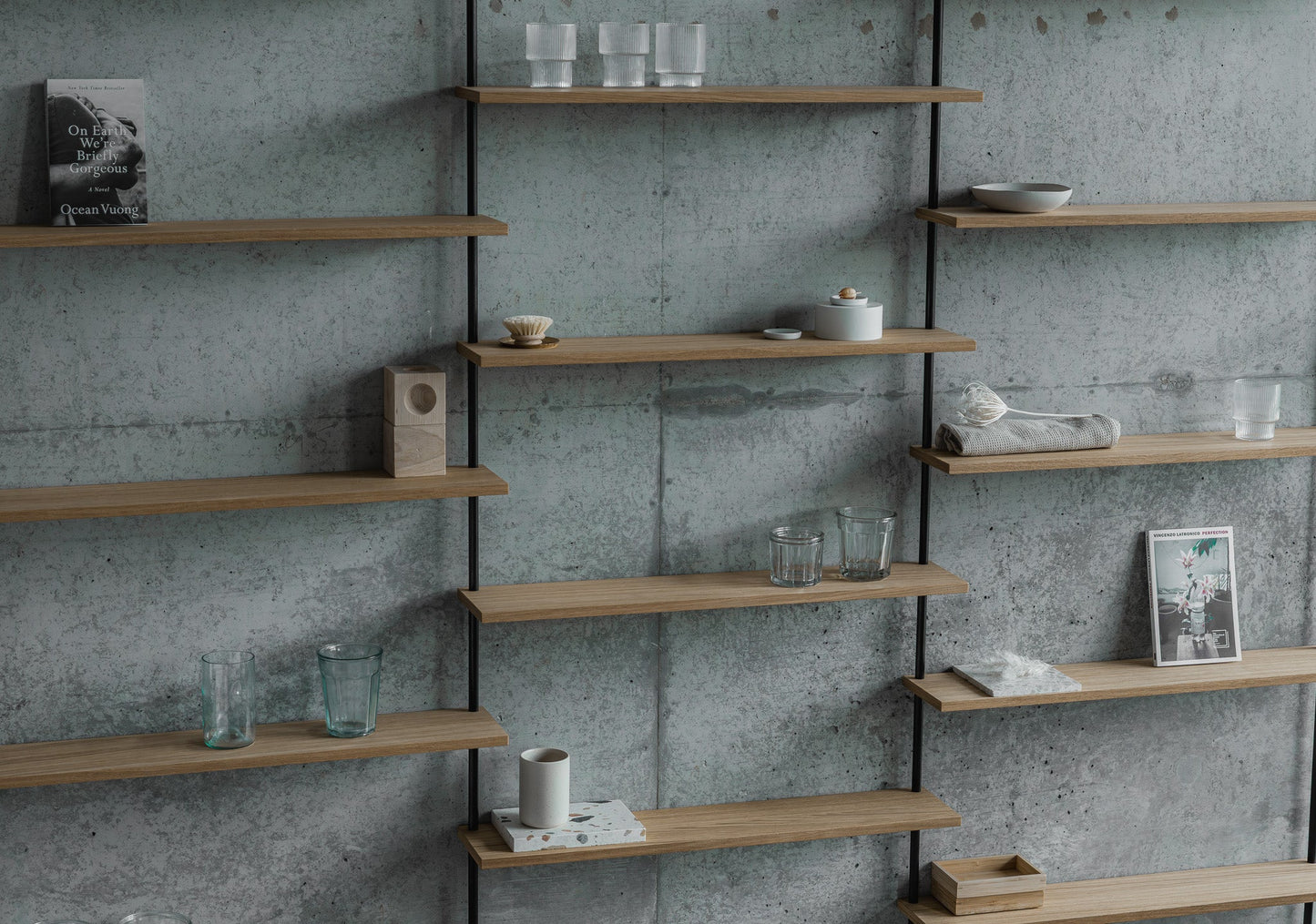 Large triple-section oak wall shelf with offset levels — KUUDU modular shelving system